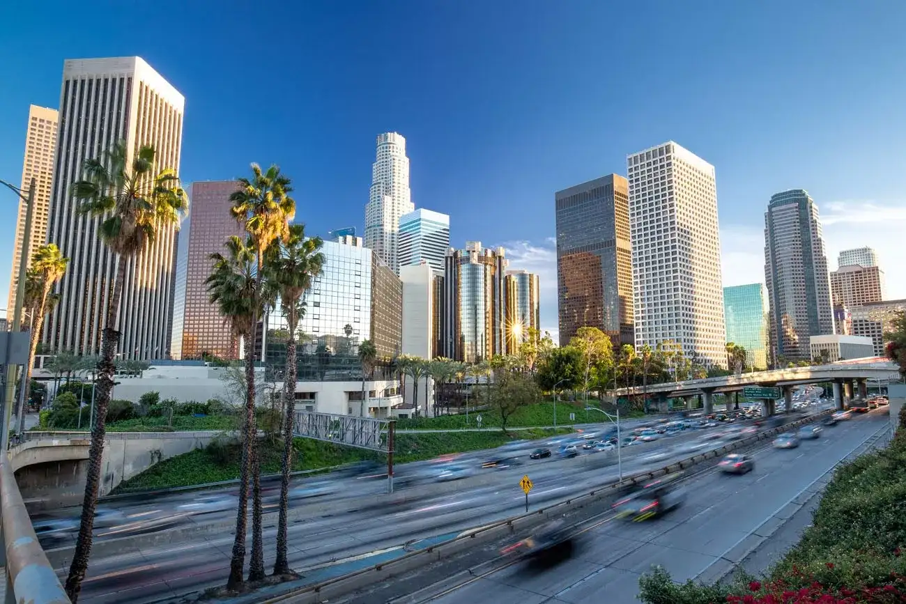 Los Angeles evening sunset highway traffic skyline buildings